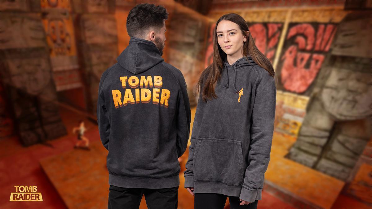 A grey hoodie with a silhouette of Lara Croft and the logo from the original Tomb Raider game.