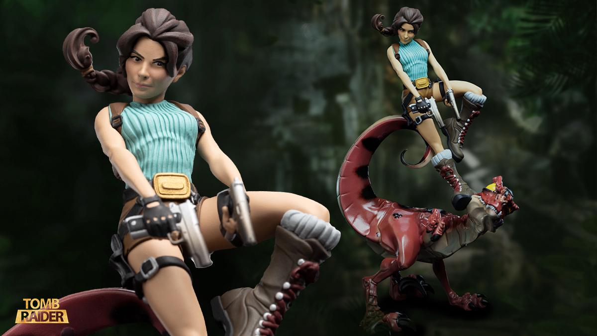 A collectible of Lara Croft dueling a velociraptor.