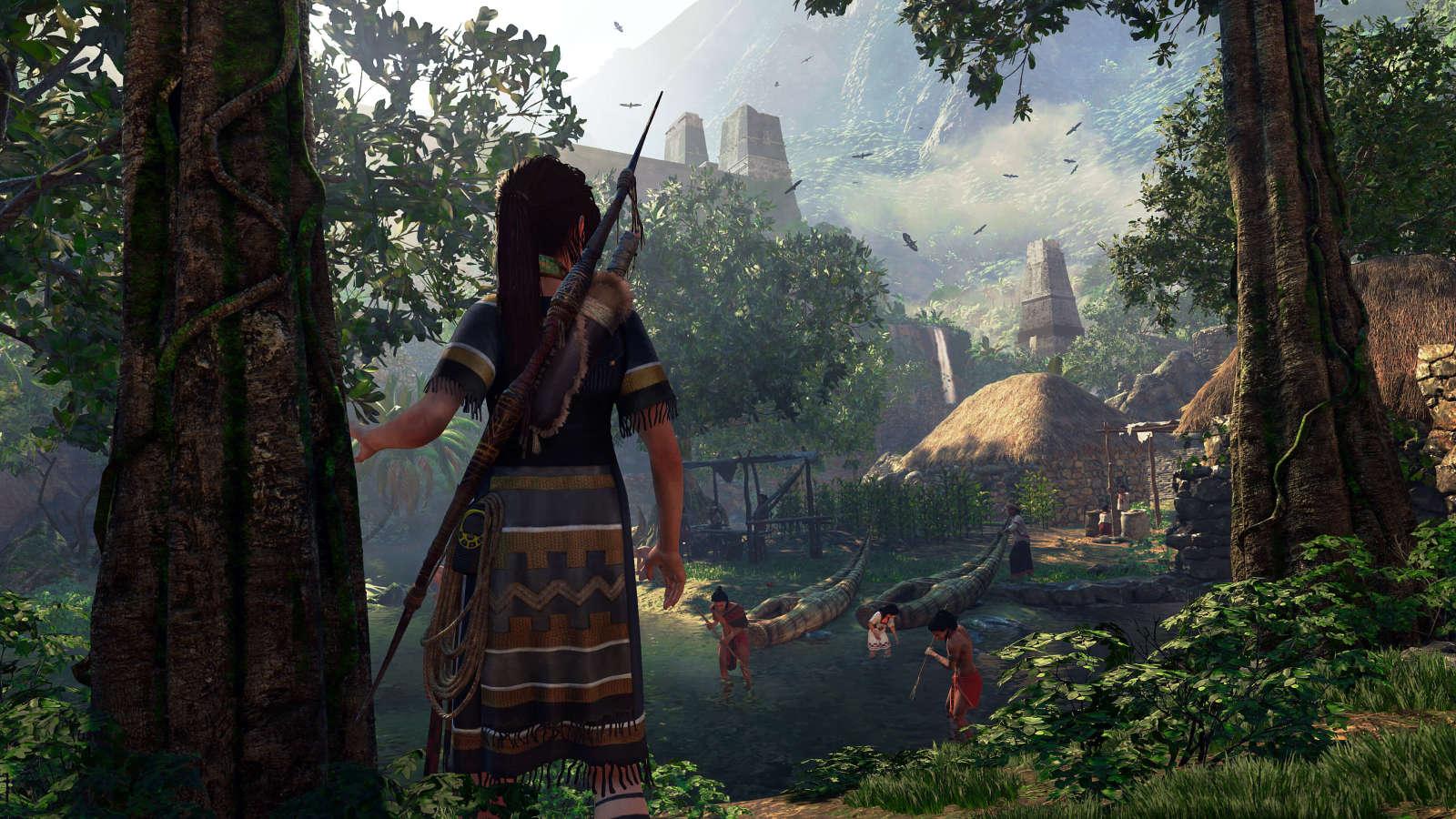 An in-game scene from a Tomb Raider game showing Lara Croft overlooking a peaceful village with thatched huts amidst a lush jungle.