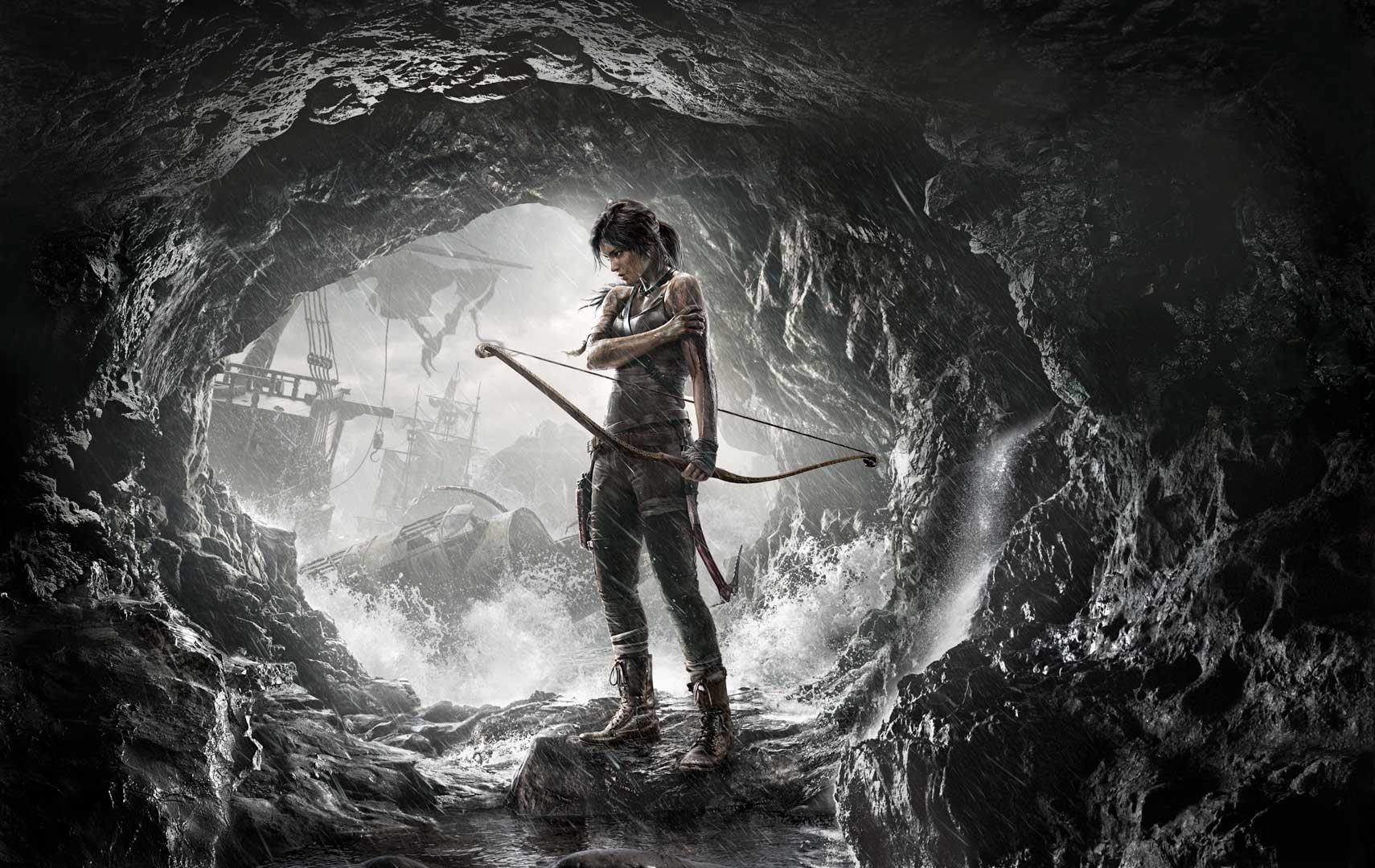 A somber, atmospheric scene of Lara holding a bow, standing at the entrance of a cave with a shipwreck in the distance.