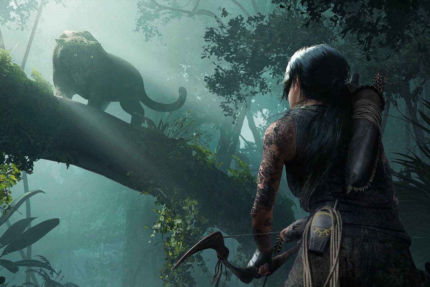 An intense moment from a Tomb Raider game where Lara Croft, armed with a bow, stealthily approaches a jaguar perched on a tree branch in a foggy, dense jungle environment.