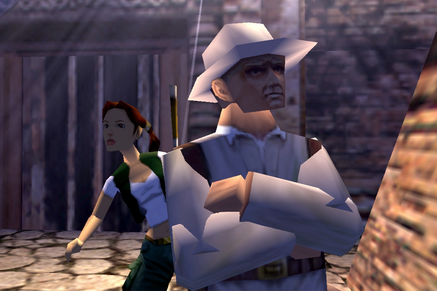Lara Croft standing behind Professor Werner Von Croy, a renowned archaeologist-adventurer.