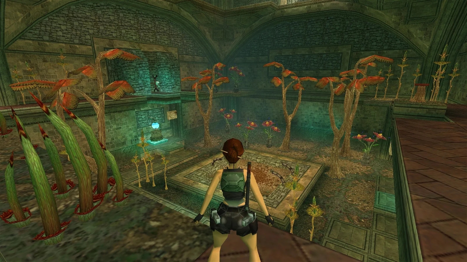 A video game screenshot showing Lara Croft overlooking an underwater room filled with coral and aquatic plants.