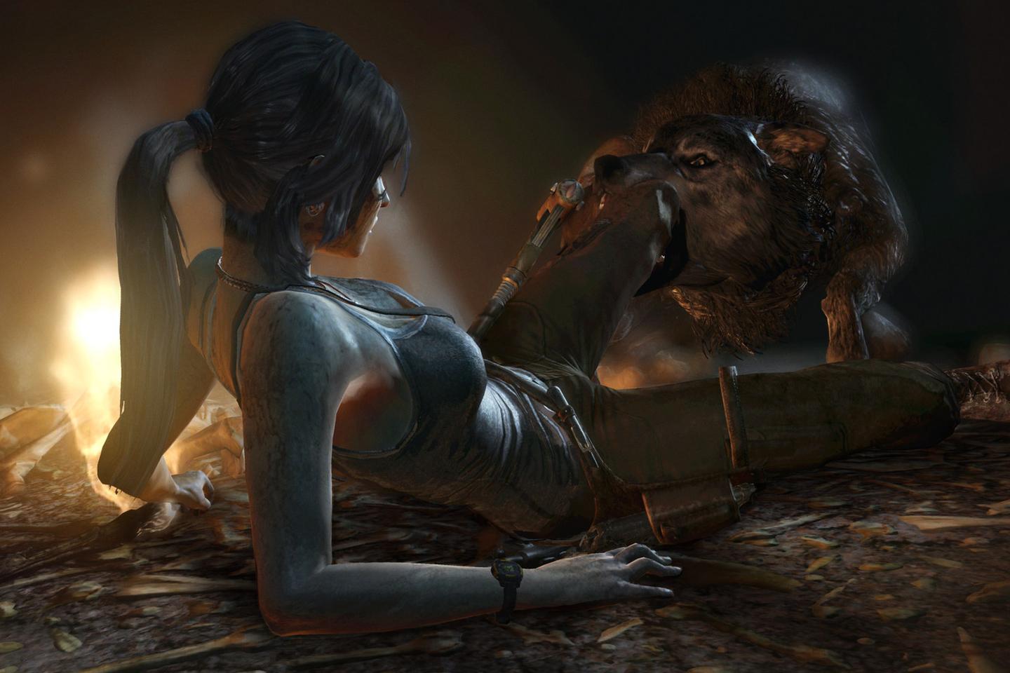 Lara being attacked by a wolf who has hold of her left leg.
