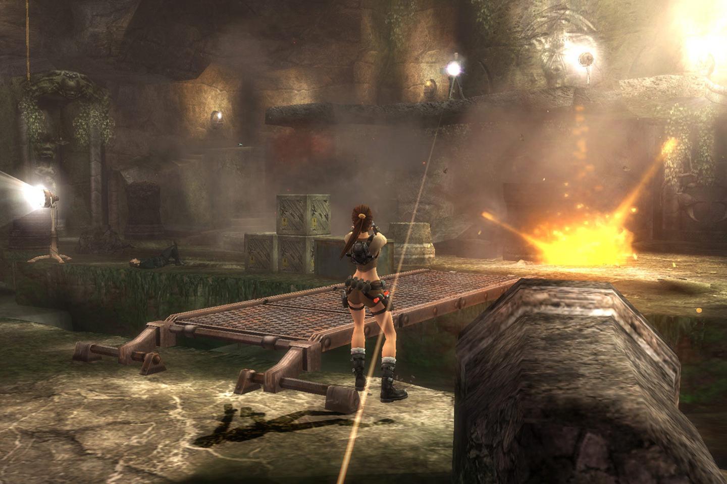 Lara facing bridge with small explosion happening on the other side.
