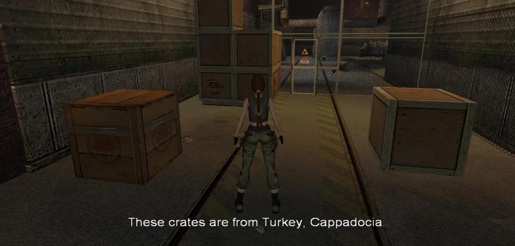An in-game scene with a character observing crates, with a text overlay mentioning Turkey, Cappadocia, indicating a location within the game's story.
