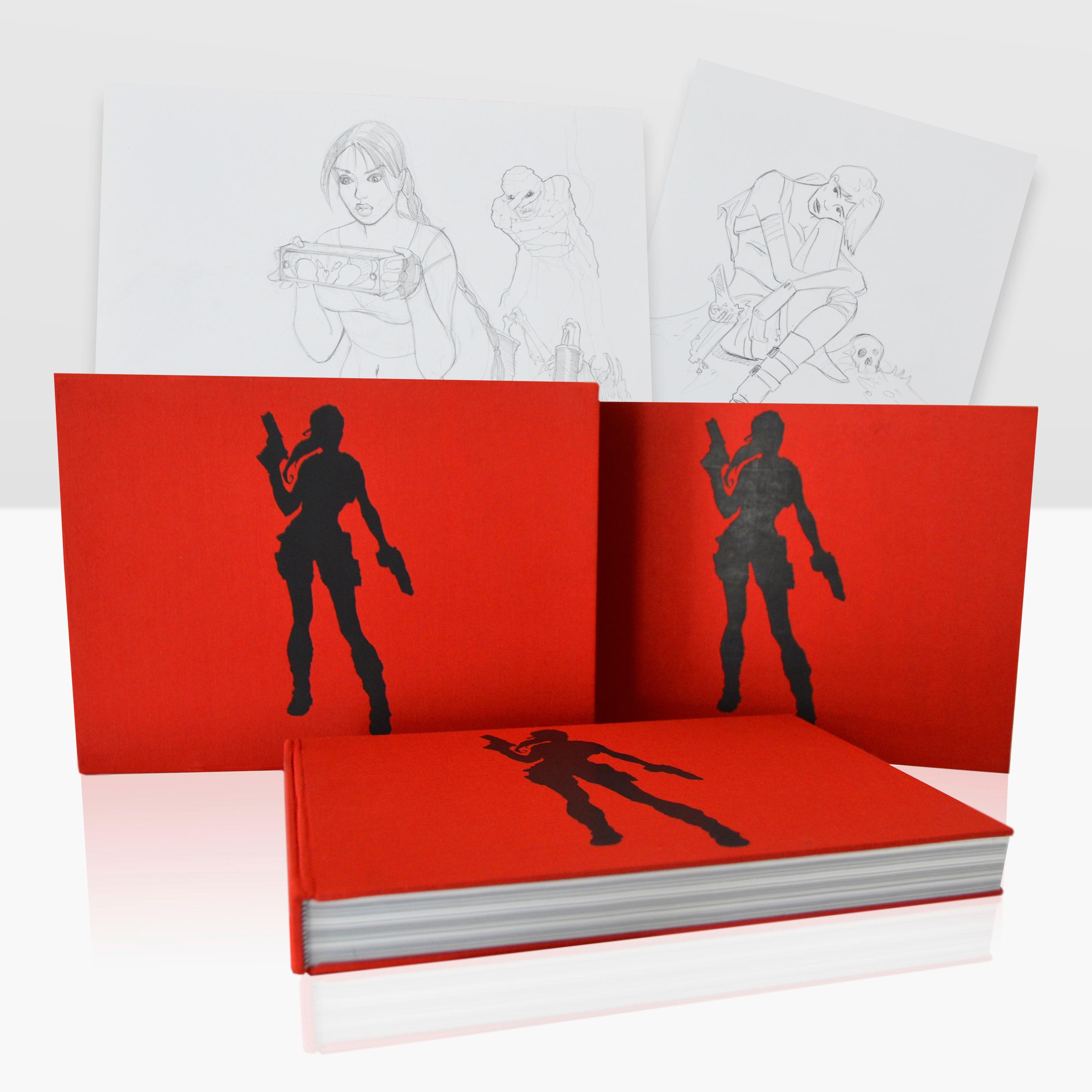 A photograph of a red Tomb Raider art book.