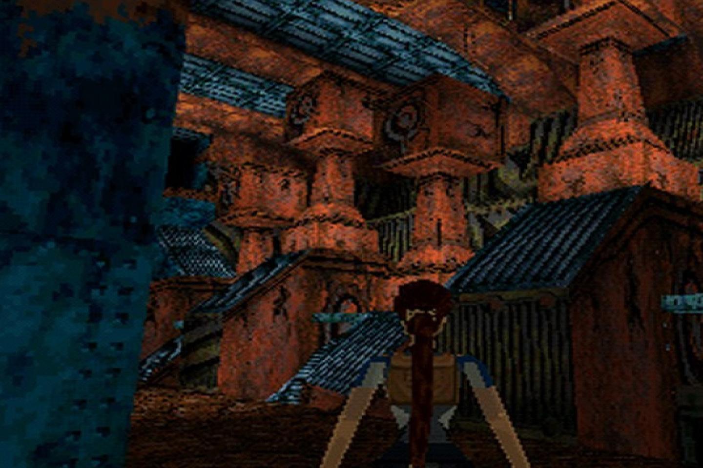 Lara facing red rock tombs