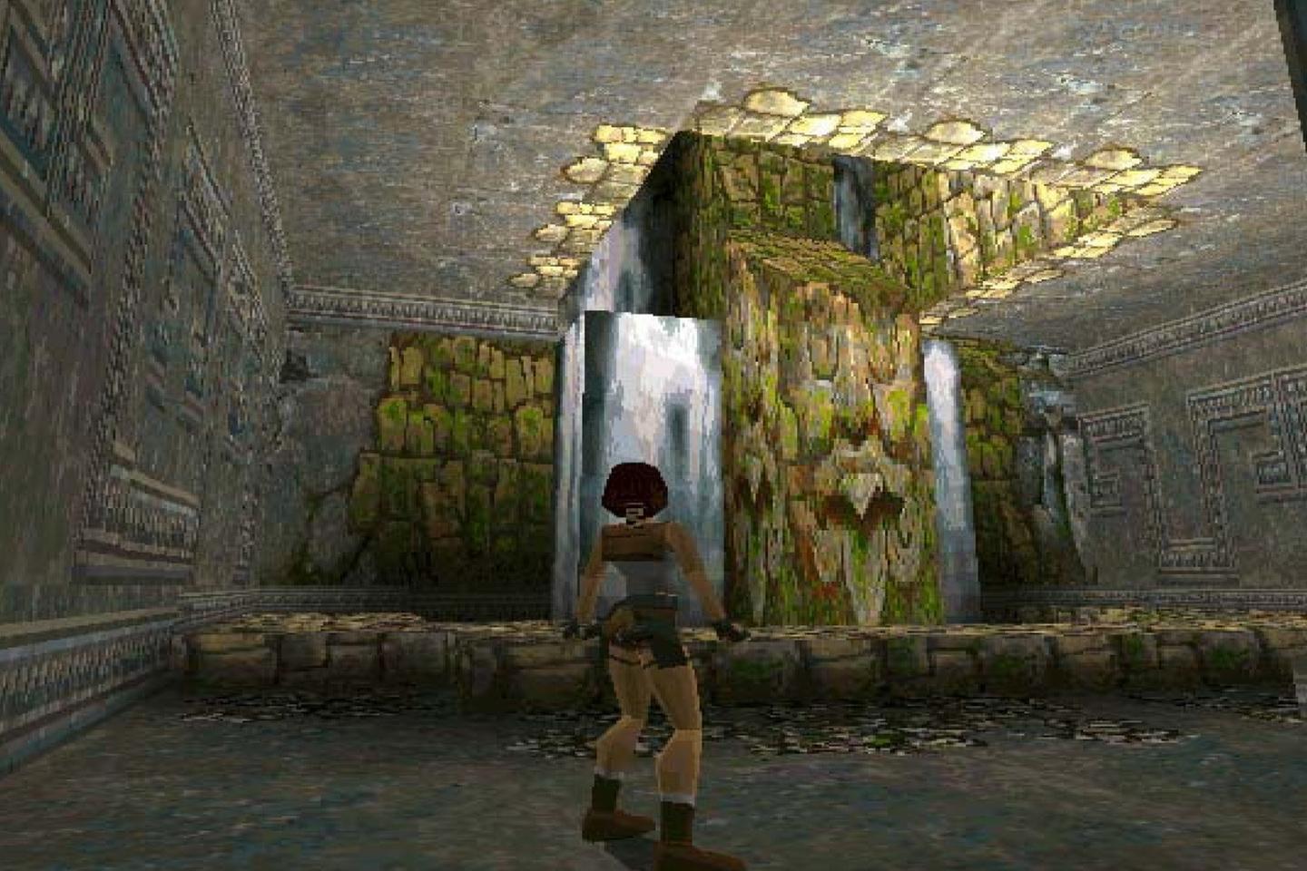 Lara looking at waterfalls inside tomb.